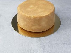 a round cake sitting on top of a metal plate