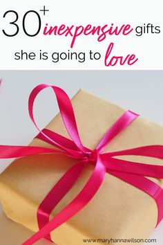 a gift wrapped in brown paper with pink ribbon and the words 30 + expensive gifts she is going to love