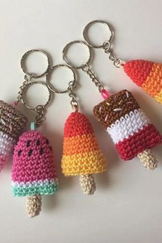 four amigurt ice cream keychains are shown