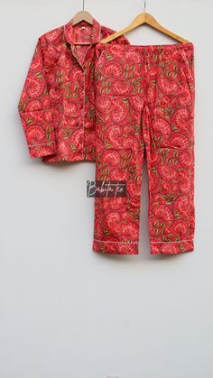 "Designed and customized in our India store, the love and care we put into every PJ will stand out to you at the moment you see it. Full sleeve shirt with buttons and loose fit trousers. Completely handmade in Jaipur from 100% pure cotton fabric. Comes in S/M/L/XL sizes, but without any complications can be adjusted to individual measurements. Note: The color and brightness of actual product may vary due to digital photography and photo editing. We crossed check each and every product before lis Printed Cotton Sleepwear For Bedtime, Printed Long Sleeve Bedtime Sets, Red Cotton Sleepwear For Home, Red Cotton Sleepwear Sets, Red Cotton Matching Set, Red Pajama Party Sets, Cotton Matching Sets For Bedtime, Red Matching Set For Loungewear, Cotton Bedtime Matching Sets