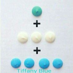 three different colored buttons on a white surface with the words tiffany blue written below them