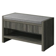 a gray wooden table with a grey cushion on the top and bottom shelf below it