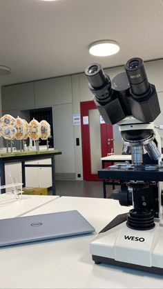 a microscope sitting on top of a white table