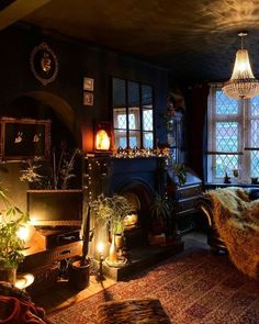 a living room filled with furniture and a fire place next to a window covered in lights