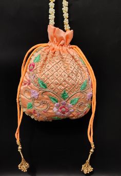 "floral texture zardosi thread embroider peach silk hand bag for woman designer | wedding favor drawstring purse pouch with beaded chain Package Contents: 1 Size: 10\" x 8\" Designed with the heart, this beautiful Potli or batawa bag are eye catchy and made of premium material. Key Features: Zardosi embroidery art work. This potli is good match with both Indian and western outfits and are superb for wedding and festive parties. This would be best complement to your designer saree, lenhga or any Wedding Party Bags, Party Face Masks, Zardosi Embroidery, Hand Bags For Women, Drawstring Purse, Floral Texture, Potli Bags, Modern Embroidery, Designer Saree