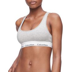 A Calvin Klein icon. This modern bralette is the definition of effortless. Made with a super-soft and supple cotton-blend construction, this bralette provides maximum stretch for all day comfort. Designed with the original Calvin Klein logo band, this is a sporty look that feels sexy everyday.Click on this INTIMATES & SLEEPWEAR Guide to find the perfect fit and more! Unlined cups Lightweight, breathable construction Hardware free Soft, flexible logo band retains shape wear after wear Style no. F Calvin Klein Bralette, Cotton Bralette, Padded Bralette, Womens Bras, Sporty Look, Brown Fashion, Bralette, Chic Style, Stretch Fabric