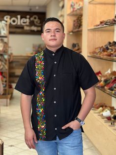 This beautiful Traditional Guayabera for Men is embroidered and adds a sophisticated flare to your wardrobe.  This elegant button up Shirt is perfect for special occasions such as Mexican Fiestas, Quinceañeras, Weddings, etc. This guayabera is handmade and completely hand embroidered by Mexican Artisans in Oaxaca, Mexico. More styles available here: https://www.etsy.com/es/shop/SoleiEthnic?ref=seller-platform-mcnav&section_id=26873542 Traditional Black Shirt With Floral Embroidery, Traditional Short Sleeve Shirt With Multicolor Embroidery, Traditional Black Embroidered Shirt, Traditional Fit Short Sleeve Shirt, Casual Embroidered Shirt Traditional Fit, Casual Embroidered Shirt With Traditional Fit, Mexican Men, Men Formal, Mens Oxfords