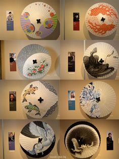 many different types of umbrellas on display in a room with pictures and photographs above them