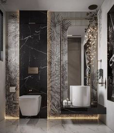 a modern bathroom with black and white marble walls, gold trimmings and lights