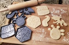 cookie cutters and cookies on a cutting board