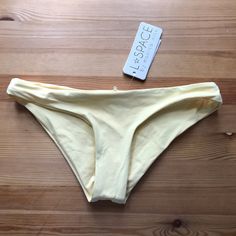 L Space Sandy Bikini Bottom In Light Pastel Yellow. Women's Size Xs. This Item Is New With Tags. Fitted Brief Swimwear For Summer, Fitted Beachwear Bottoms For Sunbathing, Fitted Brief Bottoms For Summer, Fitted Brief Bottoms For Spring, Yellow Seamless Beachwear Bottoms, Seamless Fitted Bottoms For The Beach, Seamless Fitted Swimwear Briefs, Fitted Seamless Brief Swimwear, Spring Brief Swimwear For Sunbathing