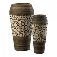 two vases made out of wood are sitting side by side on a white background