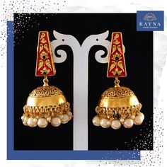 Pearl Jhumka earring complements all dresses and can be worn as a statement piece to any occasion. These earrings are unique and exhibit beauty in traditional style. Shop this style today ! #pearl #jhumka #jhumkaearring #statementearring #earring #jewelry #indianjewelry #indianjewellery #bellearring #pearlearring #june #junebirthstone #junebirthday #gift #junegift #birthdaygift #styleguide #fashion #ethnicjewelry #bohoearring #weddingjewelry #indianwedding #indiabride #desiwedding #desibride Traditional 22k Gold Bridal Earrings For Festive Occasions, Red Chandbali Jhumkas With Intricate Design, Red Bollywood Jhumkas With Intricate Design, Red Kundan Jhumkas With Intricate Design, Red Jhumkas With Intricate Design For Diwali, Gift Brass Jhumkas With Latkans, Festive Red Jhumkas With Intricate Design, Traditional Brass Jhumkas For Navratri, Festive Gold Plated Danglers Gift