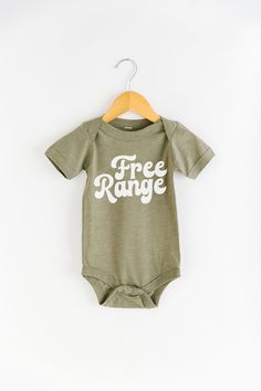 Must have: access to outdoors, raised in the open air and are free to roam.If this sounds like your kid, this Free Range onesie is a must!Product Info Unisex Fit: See size chart in product images for more details. Measurements can vary up to 1 inch depending on color, material, etc. Cream, Mustard, & Light Grey: 100% Organic Unbleached Cotton // Made in the USA // No harmful chemicals, pesticides, or artificial dyes Mauve and Heather Olive: 25% soft airlume cotton, 25% rayon, 50% polyester ( Natural Detergent, Free Range, Future Baby, Kid Tees, Sounds Like, Open Air, Tee Shop, Baby Bodysuit, Onesies