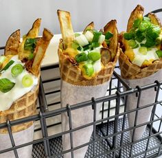 three waffle cups filled with different types of food