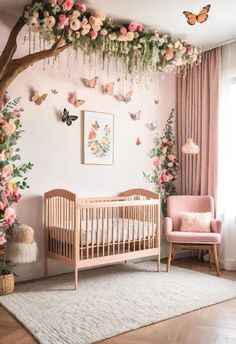 a baby's room decorated in pink and white with flowers on the wall, butterflies hanging from the ceiling