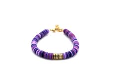 A multi purple heishi bead bracelet is the perfect on-trend accessory to top off your look. It is a great stand alone bracelet and works well as a stack bracelet, too. This non-stretch bracelet features a combination of different shades of purple polymer clay heishi beads with gold brushed metal beads in the center, all hand-strung onto flexible jewelry wire. The bracelet is finished off with a lobster clasp, and a 1" extender chain to accommodate various wrist sizes. MATERIALS Polymer Clay & Me Purple Polymer Clay, Heishi Bead Bracelet, Stack Bracelet, Purple Bracelet, Jewelry Wire, Heishi Beads, Brushed Metal, Shades Of Purple, Bracelet Stack