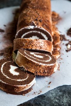 chocolate trumb swiss roll with white frosting