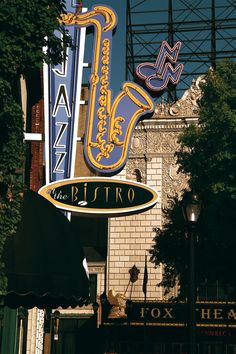 the marquee sign is hanging from the side of the building in front of it