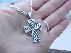 "This sterling silver pendant is just Amazing!! this Celtic Cross necklace is not just beautiful in design but also in meanings, this pendant is a symbol which emphasizes the endlessness of love of God shown through the sacrifice of Jesus on the Cross. The Celtic knot at the bottom of the cross represents friendship, affection, that cannot be broken. The trinity design on the arm of the Cross symbolizes God's love around the Holy Trinity. Also, It represents the three promises of a relationship Silver Symbolic Cross Necklace, Hallmarked Silver Cross Necklace, Silver Hallmarked Cross Necklace, Silver Cross Pendant Necklace, Hallmarked Sterling Silver Cross Necklace, Silver Stamped 925 Cross Necklace For Gift, Stamped 925 Cross Necklace For Gift, Silver Engraved Cross Pendant Necklace, Silver Cross Necklace Stamped 925