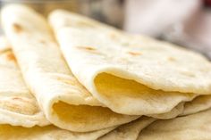 some tortillas are stacked on top of each other