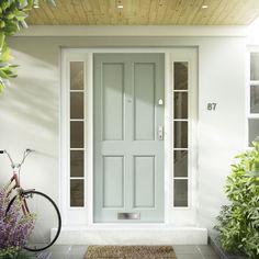 a bicycle is parked in front of a door