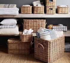 wicker baskets stacked on top of each other in front of linens and blankets