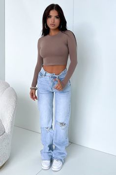 The baddie is in town! Hands down the best pair of denim jeans you'll ever own! She's got lots to offer with a semi-wide leg fit, raw bottom edges, rips at the knee, a cheeky but rip across the back, 2 functioning front + back pockets, a light blue denim wash look and a silver button + zip closure. Style her chic with a white crop + white sneaks and layer it up with a flannel + some chunky silver jewellery and a pair of sunnies. PS: These jeans do not have a-lot of stretch, if you are in between Long Sleeve Baby Tee, So Fetch, Mode Zara, Travel Outfits, Neue Outfits, Causual Outfits, Streetwear Style, Studio Shoot, Swaggy Outfits