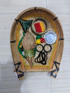 a bamboo tray with scissors, other items on it and some sort of hair clippings