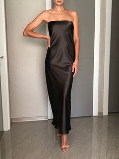 Strapless silk satin slip dress. Can be worn as a bridesmaid dress, party and date dress and for many other occasions. Made of satin silk. DESCRİPTİON:   -Strapless.  -Elastic band on the bust part.  -Adjustable bust.  -Designed for a slim but relaxed fit.  -Unlined.  -Bias cut. İt is a custom made dress, tailored according to your preferences, you can choose the length of the dress and order it without cut on the front.  While ordering write your bust and waist measure, so the dress will be made to your size. Please enquire if you're interested in different color. SIZING INFO: XS/34/US4: bust: 82-86cm (32-33 inch) waist 64-66 cm (24-25 inch)  S/36/ US6: bust: 86-88cm (33-34 inch) waist: 66-68 cm (25-26 inch) M/38/ US8: bust: 88-92 cm (34-36 inch) waist: 68-72 cm (26-28 inch) L/40/ US10: Long Tube Top Dress, Silk Strapless Bridesmaid Evening Dress, Satin Maxi Slip Dress For Party, Chic Silk Strapless Dress For Prom, Silk Strapless Dress With Straight Neckline For Party, Silk Strapless Dress For Bridesmaids, Sleek Modal Satin Maxi Dress For Party, Wedding Satin Dress With Straight Neckline, Satin Slip Dress With Straight Neckline For Night Out