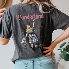 ✺✺  PLEASE NOTE THIS IS A BACK DESIGN ✺✺   Get ready to be OBSESSED with your new Alice in Wonderland shirt. It's the cutest and most trendy way to combine all those important trendy dark academia and coquette clothing vibes! This is the perfect Lewis Carroll shirt!  * Q U I C K * F A C T S * ✺  All shirts are UNISEX ✺  100%  ringspun cotton (fiber content may vary for different colors) ✺  Soft-washed, garment-dyed fabric brings extra coziness ✺  Wash and dry normally (on cool for best results) ✺  Sewn-in twill label * S I Z I N G * ✺ For an oversized fit, select two or three sizes up from your normal size ✺ Model is wearing size L  ✺ Sizing runs true to size ✺ Relaxed fit ✺ Most women find their typical size works best, since they are meant to fit a touch loose ✺ See Size guide and fit in Black Relaxed Fit Tops With Bookish Style, Themed Cotton Shirt With Custom Print, Themed Cotton Shirt Pre-shrunk, Themed Pre-shrunk Cotton Shirt, School Tops With Graphic Print In Bookish Style, Themed Cotton Shirt With Graphic Print, Themed Graphic Print Cotton Shirt, Bookish Graphic Print Tops For School, Bookish Cotton Tops With Character Print