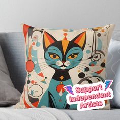 a pillow with an image of a cat on it and the words support independent artists