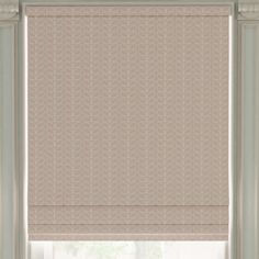 a window with roman blinds in beige