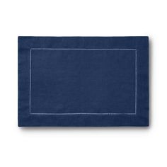 a blue linen placemat with white stitching on the edges and an embroidered border