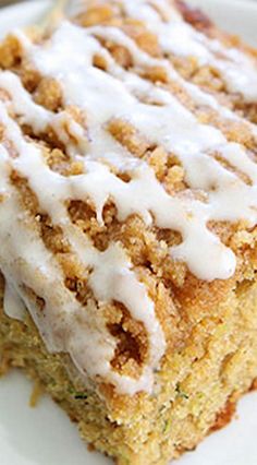 a piece of cake on a plate with icing