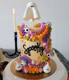 there is a birthday cake decorated with spooky decorations on the top and bottom