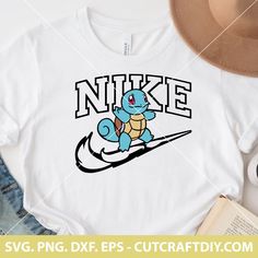 a t - shirt that says nike with a cartoon turtle riding a snowboard on it