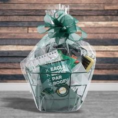 a basket filled with assorted items sitting on top of a wooden table