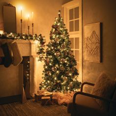 a living room with a lit christmas tree in the corner