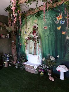 the room is decorated with flowers, butterflies and a fairy bed in front of a forest backdrop