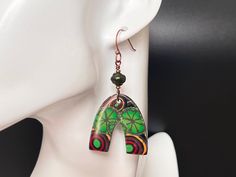 Boho chic anyone? These polymer clay earrings have beautiful shades of green complimented by touches of orange and red. They are finished with copper hardware. They are handmade and very lightweight. Bohemian Green Polymer Clay Earrings, Green Bohemian Polymer Clay Earrings, Green Hand Painted Copper Earrings, Boho Polymer Clay, Copper Hardware, Polymer Clay Earrings, Shades Of Green, Clay Earrings, Favorite Jewelry