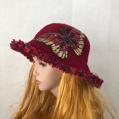 I created this beautiful hat in a dramatic combination of crimson red and golden colors.  Tightly crocheted red hat I decorated with big, shiny, sequined red, silver and gold butterfly. The hat is unique, well done and beautiful. It is a statement hat, which will attract a lot of attention and compliments. Fits most of average and big  adults heads. Comes from my smoke and pet free studio. There are more hats here: http://www.etsy.com/shop/Iryna?section_id=5059710 Send me a message if you need more information about this hat or any other item in my shop. Best wishes  from Iryna Red Crochet Wide Brim Hat, Red Wide Brim Crochet Hat, Red Crochet Hat For Spring, Red Brimmed Crochet Hat For Spring, Red Wide Brim Crochet Hat For Spring, Adjustable Crochet Party Hat, Handmade Red Party Hat, Red One Size Bucket Hat, Bohemian Red Wide Brim Bucket Hat