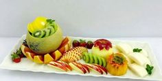 a white plate topped with cut up fruit