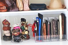 a shelf filled with lots of purses and hats