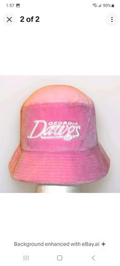 a pink hat with the word deucer on it