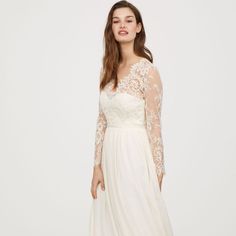 Dress Features A Beautiful V-Shaped Neckline, A Lace Bodice, Delicate Lace Sleeves, And A Flared Skirt. New With Tags, Never Been Worn. No Stains, Tears Or Imperfections. Color Is Ivory, Not Pure White. Original Price $299 V-neck Evening Dress With Lace Back For Wedding, Sheer Bodice V-neck Wedding Dress, Bridesmaid Dress With Lace Sleeves And Fitted Bodice, Elegant V-neck Bridal Dress, Wedding Evening Dress With Lace Sleeves And Sweetheart Neckline, White V-neck Wedding Dress With Lace Bodice, V-neck Maxi Dress With Sheer Bodice For Wedding, White Lace Sleeves Evening Dress For Wedding, White Evening Dress With Lace Sleeves For Wedding