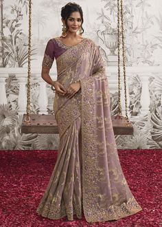 This free flowing saree gives you a charming and elegant look on drape. Simple, classy and comfortable for any wedding and festive. --------------------------------- S A R E E ● D E T A I L S --------------------------------- ● Fall and Edging : Done ● Tassel : See in Option ● Petticoat : On request Extra Charges ● Drapping Saree (Ready to wear) : On Request Extra Charges ● Blouse : Matching Unstitched Piece (See in option) ● Occasion : Wedding, Party, Festive, Function ● Type: Bollywood ● Includes : 1 Saree, 1 Blouse Piece ● Saree length : 5.5 meter ● Blouse piece : 0.8 meter ● Wash Instruction:- Dry Clean Only Premium quality Product with Fine Finishing 🎁      Gift for Women This lovely Organza Silk Saree makes for a fantastic gift for your special and loved ones on their special day or Engagement Saree, Wedding Sari, Saree Designs Party Wear, Elegant Attire, Net Saree, Embroidered Wedding, Stylish Sarees, Work Sarees, Saree Look