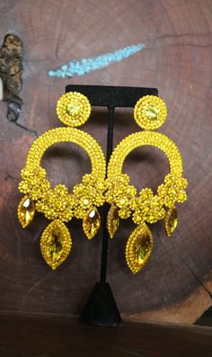 "These fun and stylish oversized crystal rhinestone earrings are a great statement piece! Pageant, photo shoots or fitness competitions! Size of earrings: 2.5\" Wide and 5.25\" Long. Color: Citrine Yellow rhinestones Looking for a matching bracelet? Check out our listings or send us a message! https://www.etsy.com/listing/701653437/yellow-bracelet-yellow-rhinestone?ref=shop_home_active_58 https://www.etsy.com/listing/600464738/yellow-bracelet-yellow-and-gold-bracelet?ref=shop_home_active_47 Look Yellow Dangle Crystal Earrings For Party, Yellow Crystal Earrings For Party, Yellow Dangle Crystal Party Earrings, Yellow Rhinestone Jewelry For Party, Yellow Rhinestone Party Jewelry, Yellow Dangle Chandelier Earrings For Party, Pageant Earrings, Bridal Clip, Yellow Bracelet