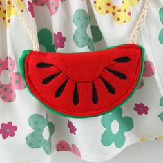 This summer, treat your child to the Crocus Doll Collar Sundress with Watermelon Purse Set. Made from a breathable cotton blend, this ensemble boasts a doll collar design that maximizes comfort. The sleeveless style is perfect for hot days, while the flowery pattern and loose fit add a touch of adorable charm. To make dressing a breeze, the dress features a concealed back zipper closure. As a bonus, the set includes a matching draw string crossbody bag, making it an ideal stylish outfit. Availab Playful Doll Collar Summer Dress, Playful Summer Dress With Doll Collar, Baby Summer Dress, Watermelon Purse, Watermelon Bag, Baby Summer Dresses, Flower Collar, Doll Collar, Summer Girl