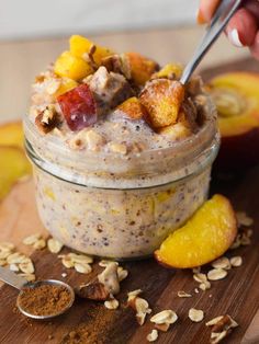 a close up of a bowl of oatmeal with fruit